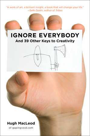 Ignore Everybody book cover shows a human hand holding a business card with the title of the book on the business card